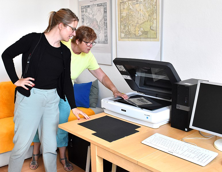 Flatbed scanner, used for digitizing loose documents and flat materials.
