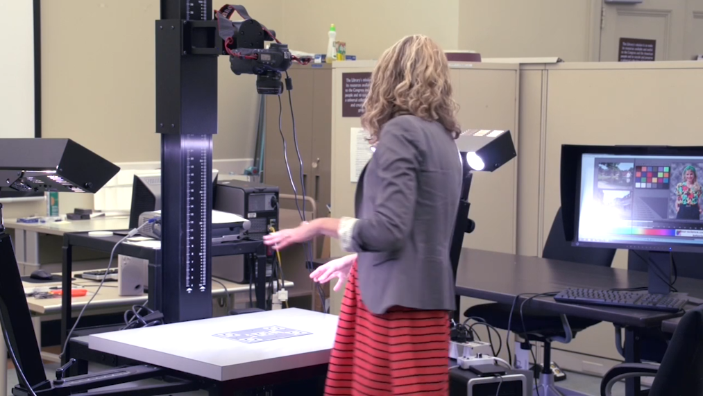 Copy stand setup with DSLR camera, used for digitizing books and fragile materials.