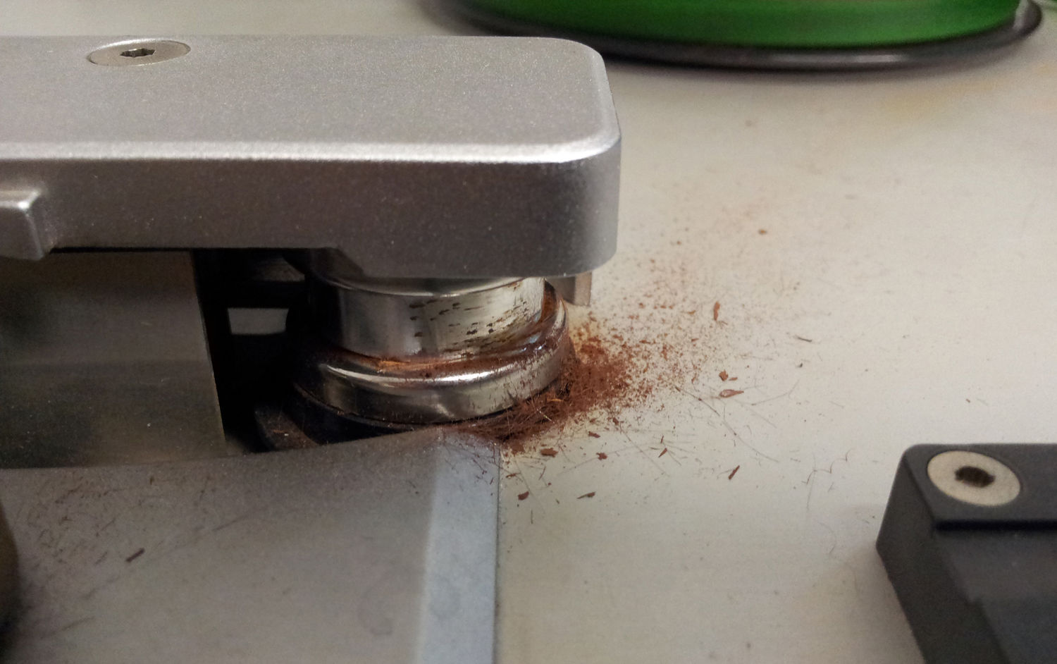 Image showing a capstan caked in sticky shed syndrome particulate matter
