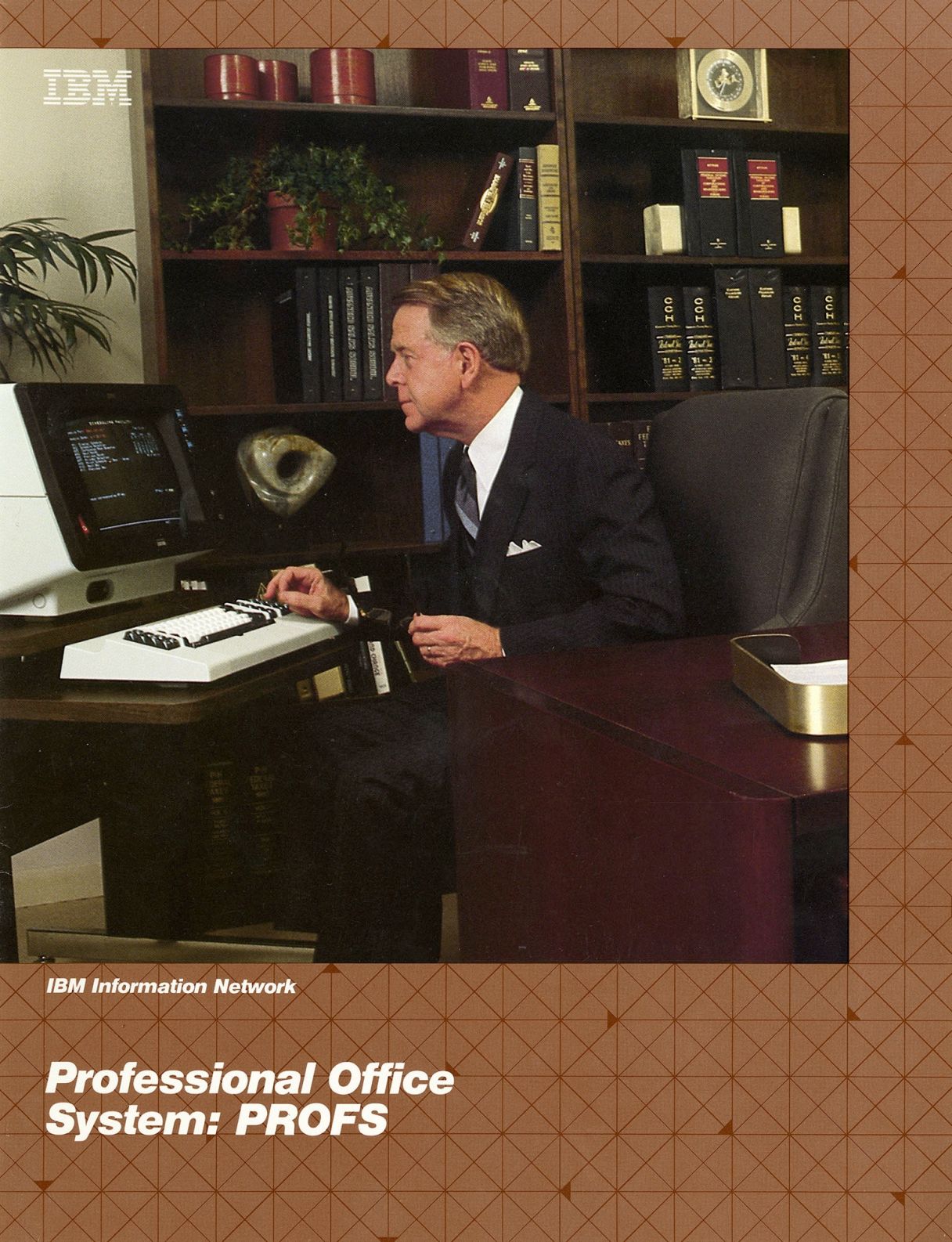 Vintage IBM ad showing a suited white CEOish middle-aged male looking at a terminal console connected to a keyboard.